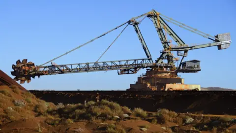 Getty Images Digging iron ore