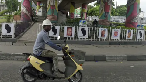 AFP Portraits of some of the Chibok schoolgirls abducted by Boko Haram five years ago on displayed at Falomo roundabout in Lagos, Nigeria