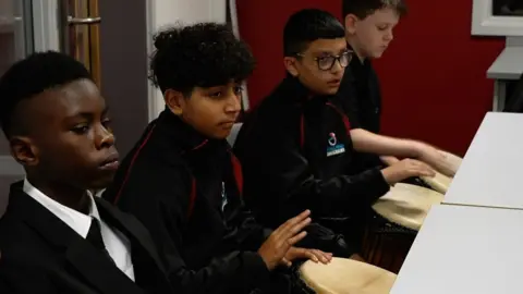 BBC/Neil Paton Pupils at Shireland CBSO Academy learning West African drumming