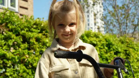 Ukrainian girl smiling with a bike