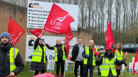 Simon Dedman/BBC Striking staff at HTS picket depot