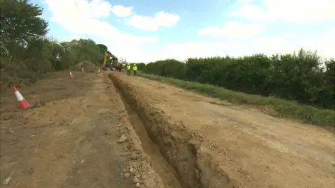 BBC Image of the road that collapsed due to badger setts and tunnels under neath.