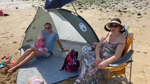 Steve from Uttoxeter on the beach at Llandudno with daughter Isabella