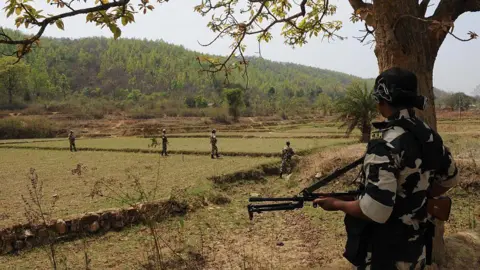 Getty Images Security forces deployed to ensure peaceful polling during the first phase of West Bengal assembly elections in April 2016 in Purulia district, India. The village is surrounded by hills from all sides and has been a Maoist stronghold since 2000. 