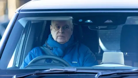 Kelvin Bruce/Goff Photos Andrew is sitting in a dark car, wearing a navy coat and navy scarf around his neck