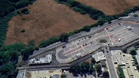 Google A map of the AWE site, with a car park on one side and a field on the other.