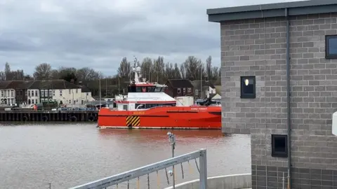 Andrew Turner/BBC Windfarm catamaran Njord Forseti waiting on a pontoon while the bridge was stuck