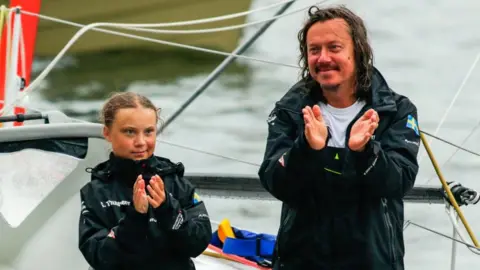 KENA BETANCUR/Getty Images Greta Thunberg and her father Svante Thunberg