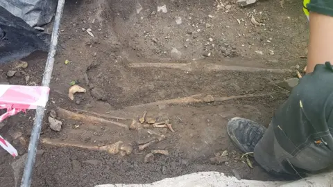 BBC Skeletons being uncovered during the dig