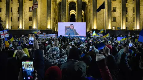 Getty Images Ukrainian President Volodymyr Zelensky delivers his national address to his people.