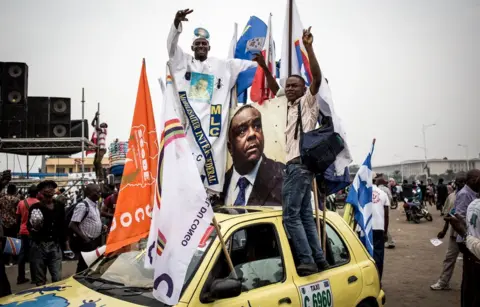 AFP Supporters celebrate ahead of an opposition rally where the main opposition presidential candidates will address supporters three months before the upcoming elections on September 29, 2018 in Kinshas