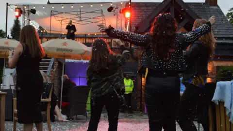 Fans watching George Michael tribute at Hale Barns Carnival