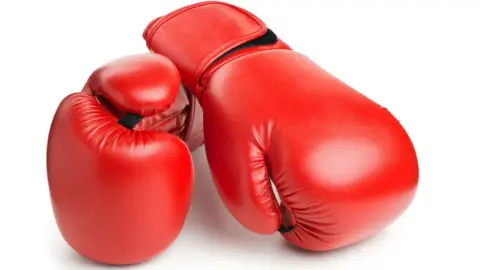 iStock A pair of red boxing gloves