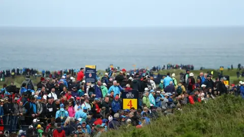 Getty Images Crowds are seen walkin the course during a practice round prior to the 148th Open Championship held on the Dunluce Links at Royal Portrush Golf Club on July 17, 2019 in Portrush