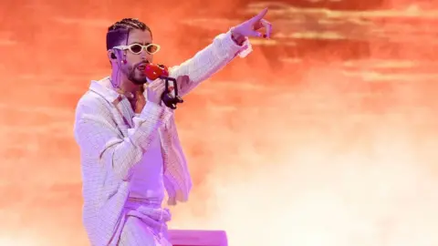 Getty Images Bad Bunny on 'The World's Hottest Tour' in August