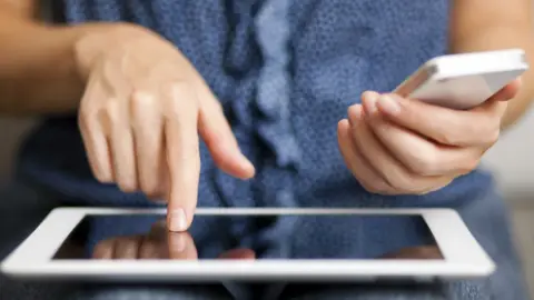 Getty Images Woman using an iPad