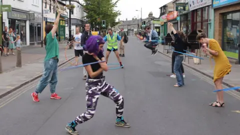Dave Baigent Hula hoopers on Mill Road, Cambridge