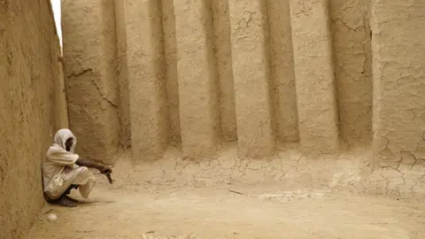 AFP A Muslim worshipper sits in the courtyard of a mosque in Mopti, Central Mali, during a visit by the United Nations General Secretary on May 30, 2018