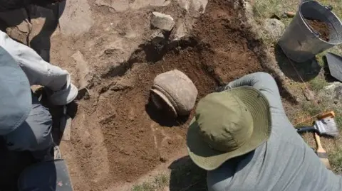 Michael Frachetti The research team excavating at the sites of Tashbulak and Tugunbulak