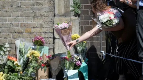 Reuters Flowers near scene of attack