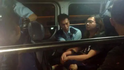 Facebook Hui Chung-wo in a police van