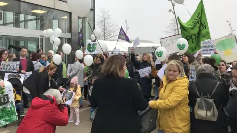Stuart Ratcliffe/BBC Protest sign at the Pen Green protest meeting in Corby