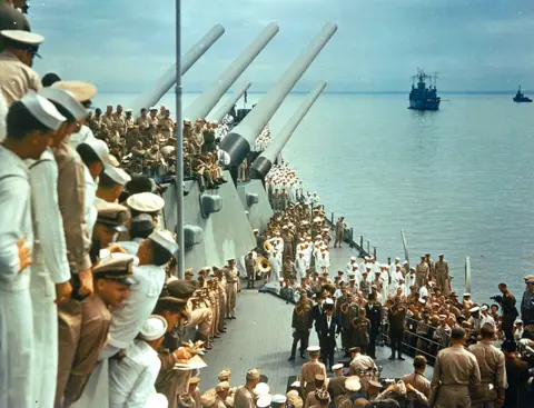 Getty Images Soldiers and sailors on the decks of the USS Missouri watch representatives from Japan formally surrender