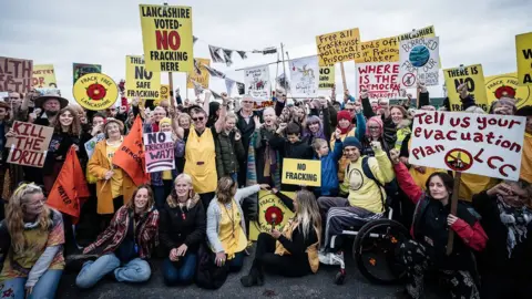 Getty Images Vivienne Westwood and son Joe Corre with protesters outside Preston New Road