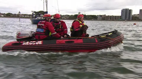 BBC Rufus and Serena Field on a boat during a training exercise