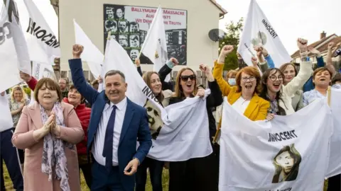 PA Media Families of the victims gathered in Ballymurphy following the inquest