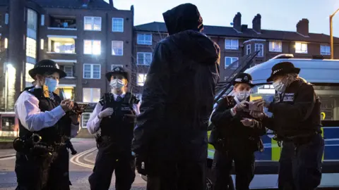 PA Media Police talking to a suspect following a stop and search in Walworth, London