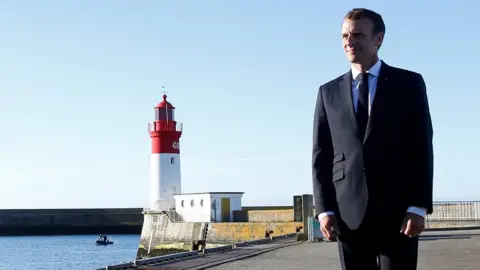 Retuers French President Emmanuel Macron visits the port in Le Guilvinec, France, June 21, 2018.