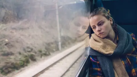 Getty Images Woman on a train stock image