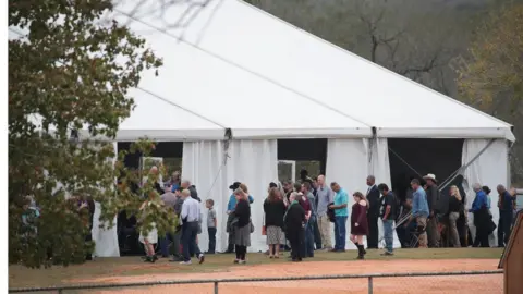 Getty Images Worshipers attend service at the temporary First Baptist Church of Sutherland Springs on November 12, 2017 in Sutherland Springs, Texas. The service was held in a tent on the site of the town's baseball field.
