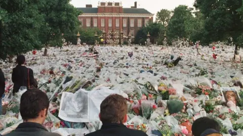 PA Media Flowers outside Kensington Palace following the death of Princess Diana in 1997