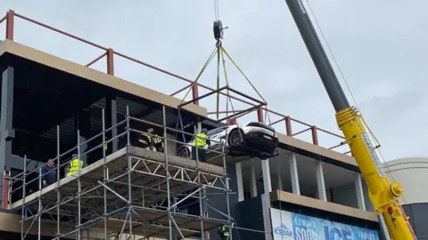 John Byford Car being hoisted up to the third floor of the nightclub