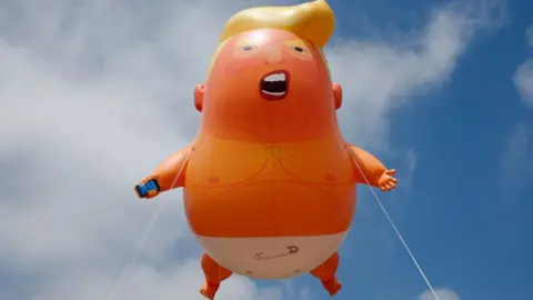 Getty Images The Donald Trump baby blimp in the skies during the protests in June 2019