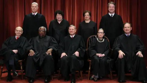 Getty Images US Supreme Court (Front L-R) Stephen Breyer, Clarence Thomas, Chief Justice John Roberts, Ruth Bader Ginsburg, Samuel Alito, Jr; (Back L-R) Neil Gorsuch, Sonia Sotomayor, Elena Kagan and Brett Kavanaugh