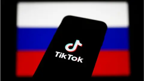 Getty Images TikTok app and Russian flag