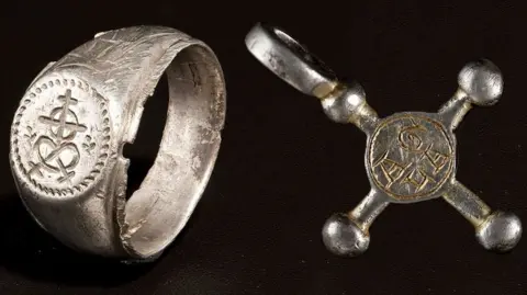 Amgueddfa Cymru-National Museum Wales A medieval merchant's ring and pendant, both most likely lost by their owners