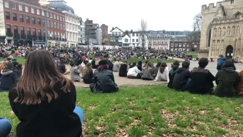 Hundreds sat down in front of Exeter Cathedral