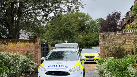 Police cars at property