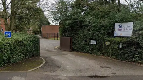 Google A Google Streetview image of the entrance to Ashby School.