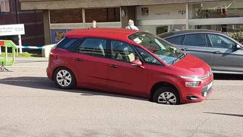 Lorna Marsh Car in a hole