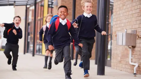 Getty Images Children running out of school