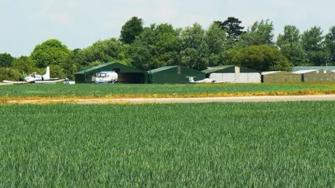 Airfield with parked gliders 