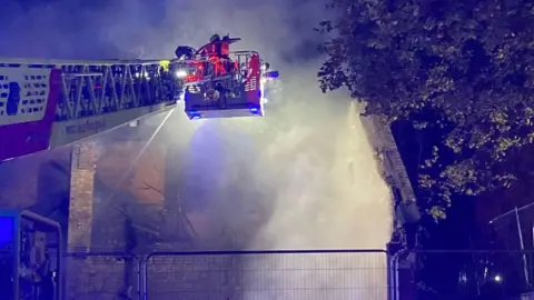 Leicestershire Fire and Rescue Service Firefighters extinguish the fire