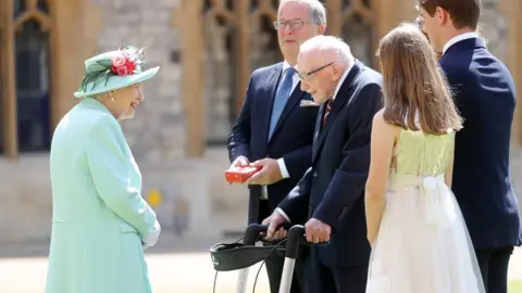 Getty Images The Queen and Capt Tom Moore