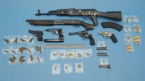 Cheshire Police Guns and ammunition seized from a loft on Rylands Drive in Warrington