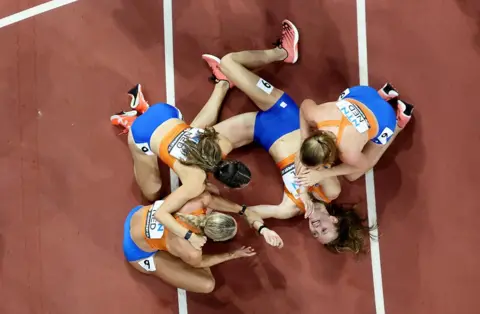 Fabrizio Bensch / Reuters Femke Bol, Eveline Saalberg, Lieke Klaver and Cathelijn Peeters celebrate